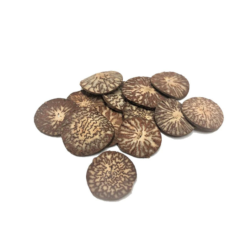 A pile of dried ginger slices on a white background.