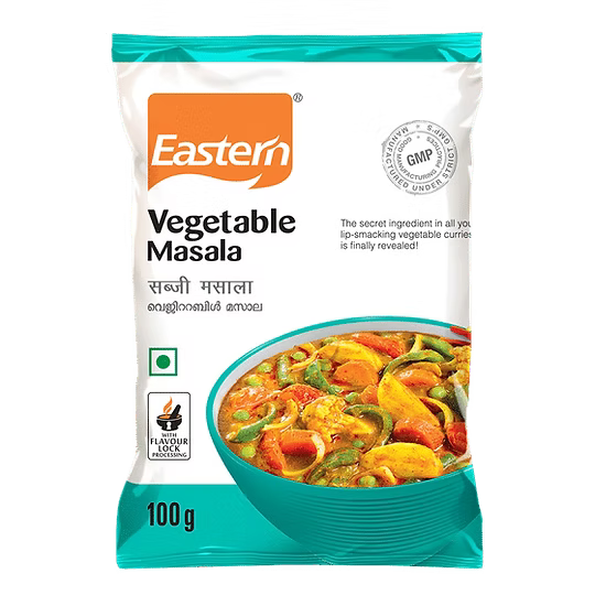 Packaging of Eastern Vegetable Masala with a bowl of curry on a white background