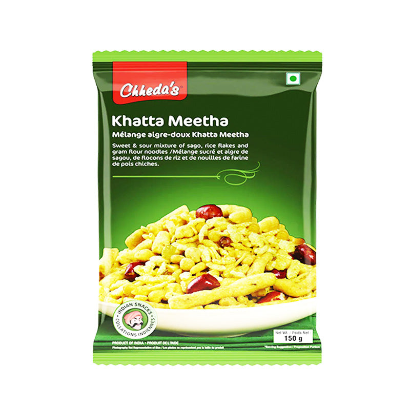 Packaging of Chheda's Khatta Meetha, showing the product name and a picture of the snack, which includes crispy rice cakes, nuts, and dried fruits, with a green background.