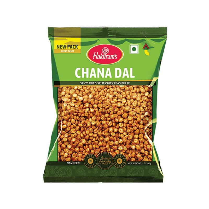 A pack of Haldiram's Chana Dal, showing the split fried gram lentils through the transparent packaging. The package is green with the brand name and product name displayed prominently.
