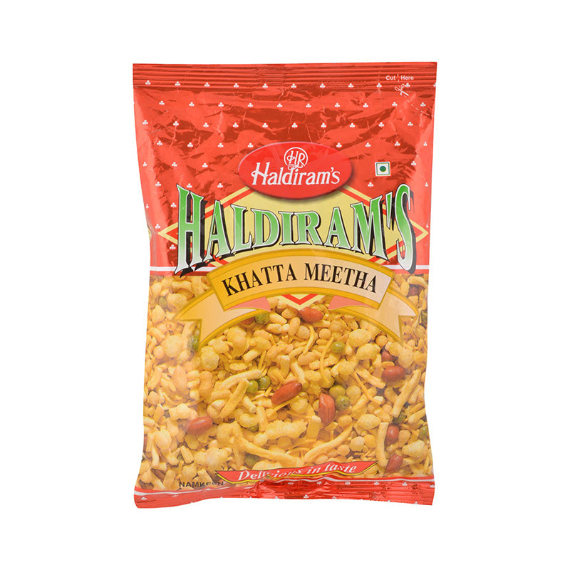 A package of Haldiram's Khatta Meetha, showing the product name and a visual of the snack mix through the transparent packaging.