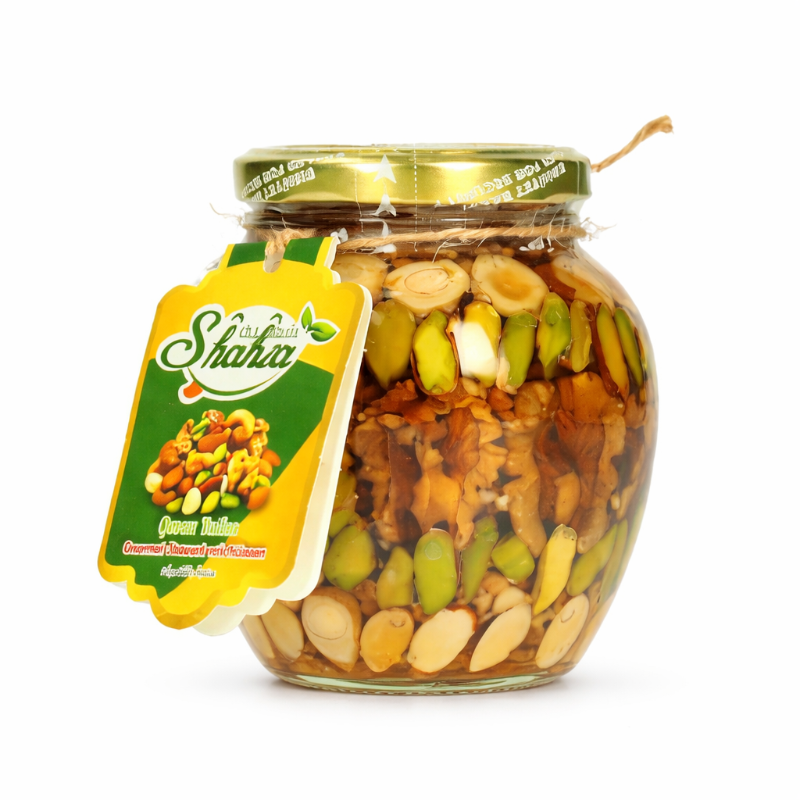 Jar of mixed nuts with a Shaha label on a white background