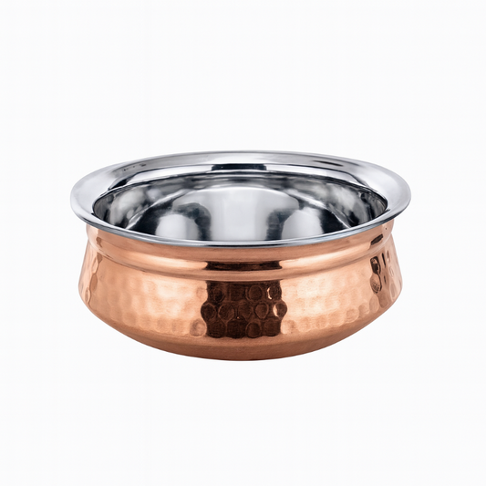 Copper and stainless steel bowl on a white background