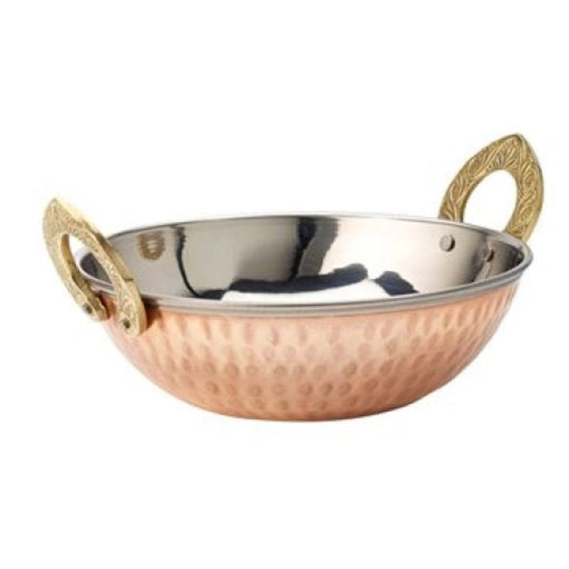 Copper and brass dish on a white background