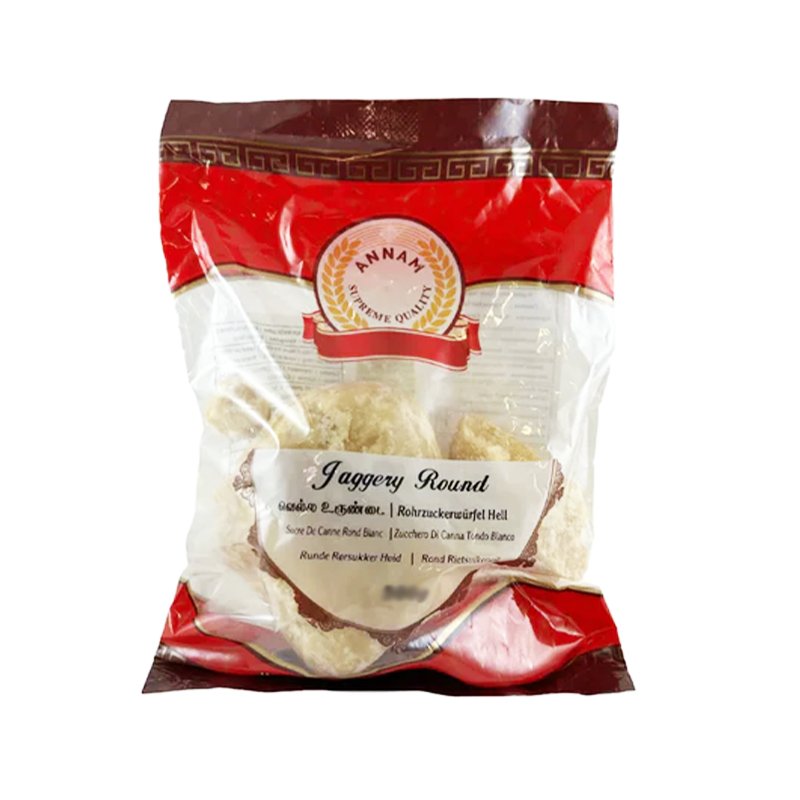 Packaging of Annam Jaggery Round 1kg, showing the product through a transparent window, with red and gold labeling.